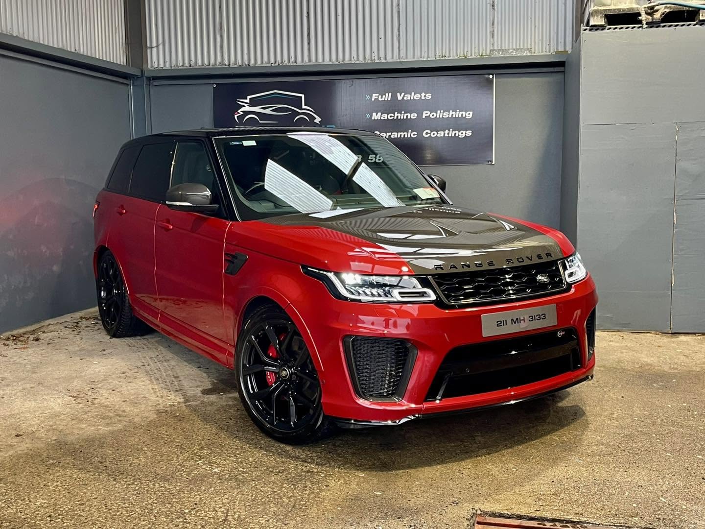 Red Range Rover with a freshly detailed high-gloss finish